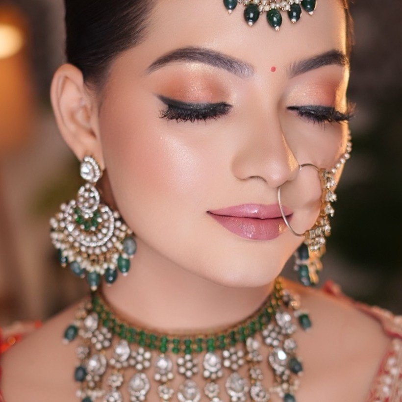Bridal makeup by Surbhi Agarwal — elegant bridal look with traditional jewelry